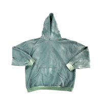 a green hoodie on a black background