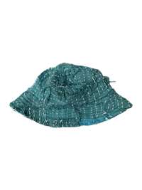 a blue bucket hat on a black background